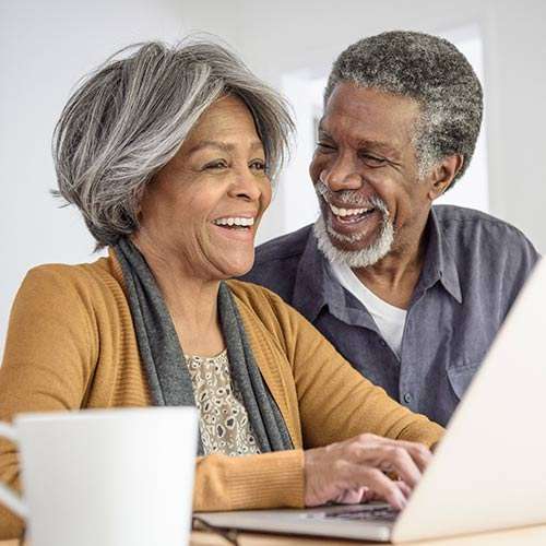 couple with a laptop